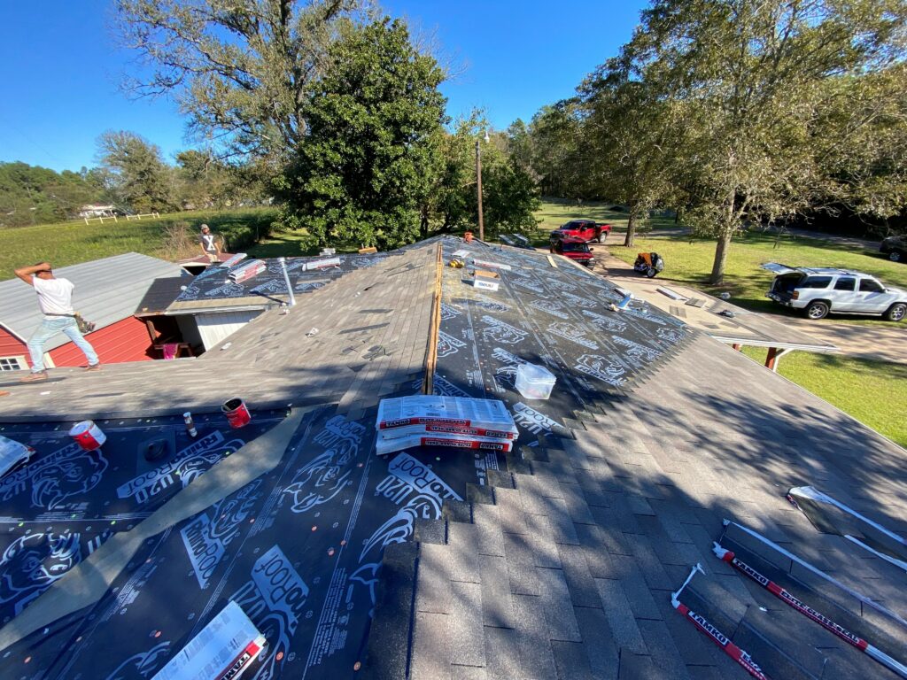 Top of roof picture of Grumbles team during home reroof project